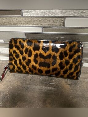 Christian Louboutin Panettone leopard-print patent leather wallet.